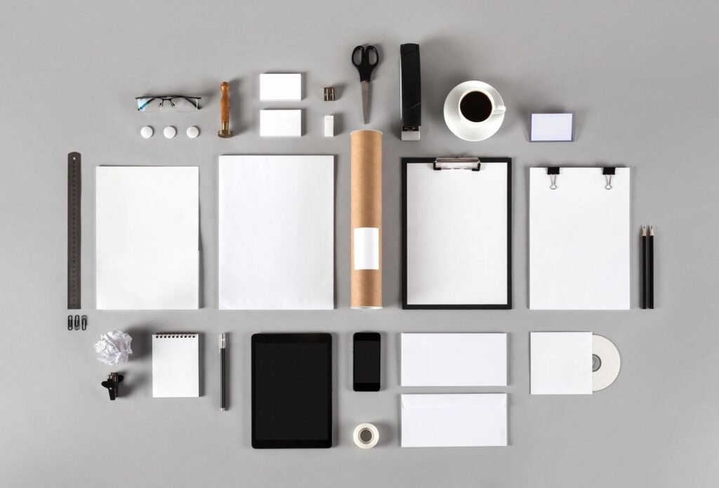 Neatly arranged office supplies and stationery on a white background.