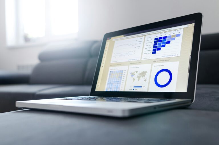 Laptop displaying data analytics and charts.